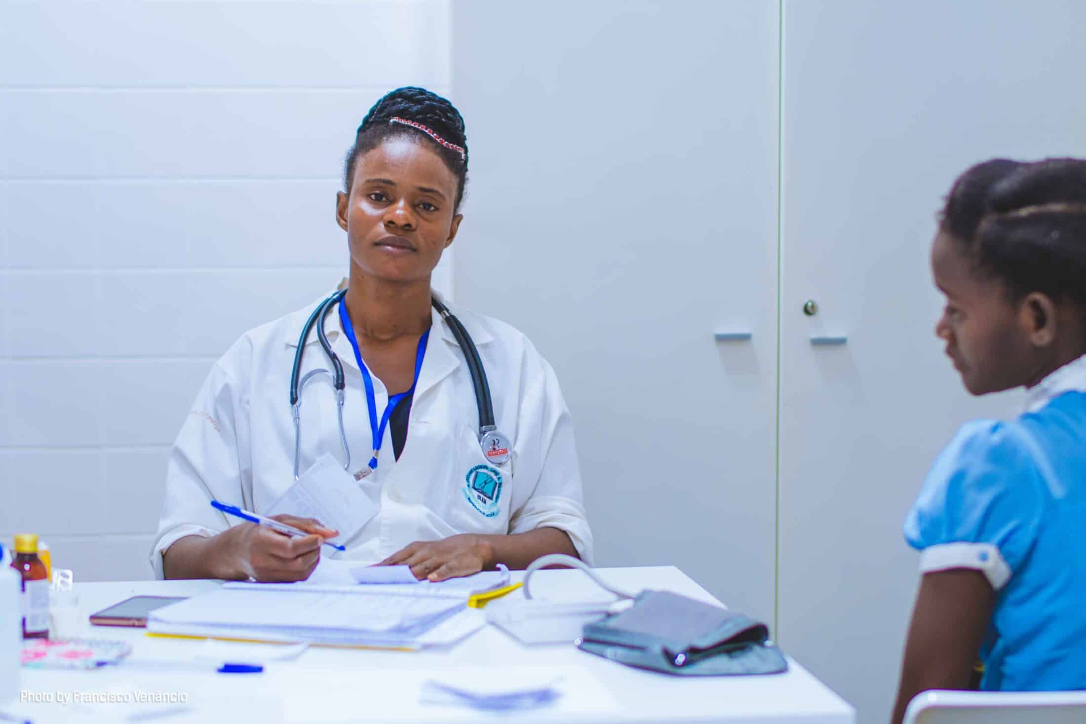 Somewhat exhausted doctor with a patient in a room